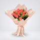 Bouquet de 24 rosas salmón envuelto en papel coreano – Ágatha & Valentina